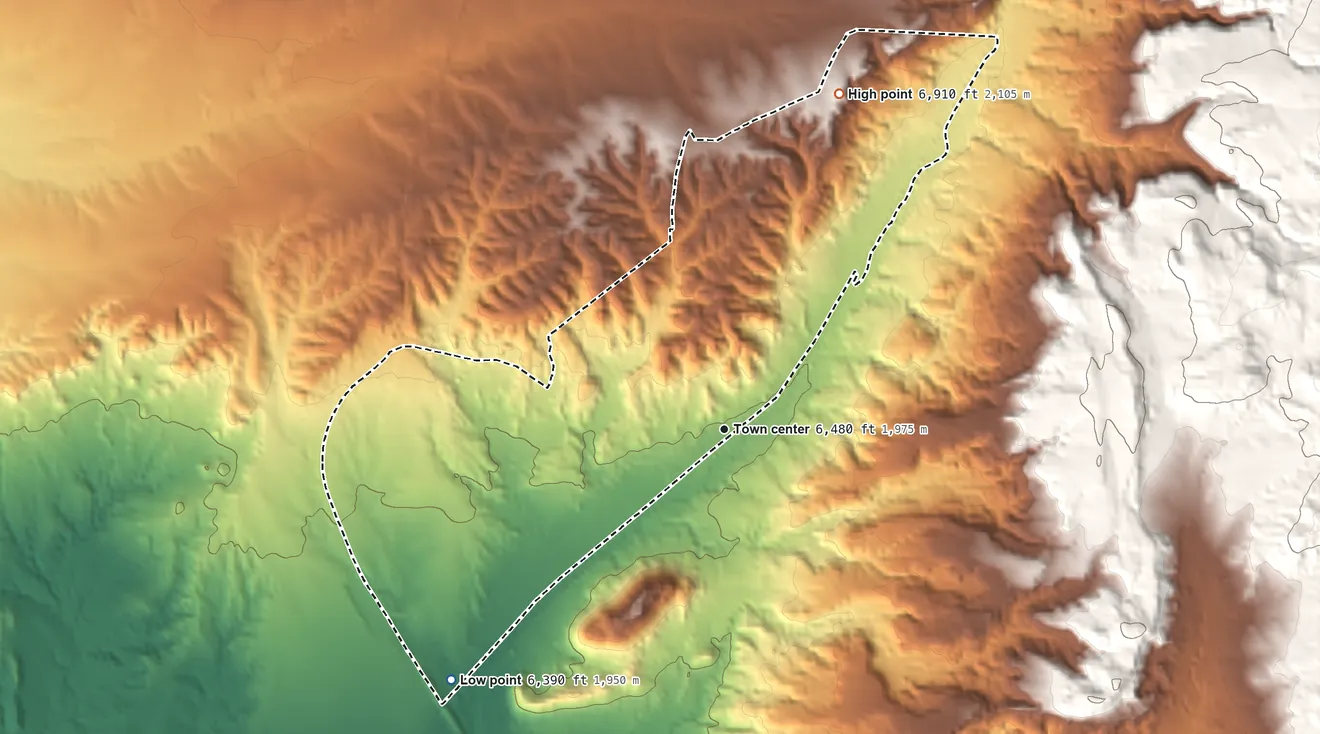 Topographic elevation map of Lamy, New Mexico, shaded from 6,390 ft on the southwest side to 6,910 ft at the foot of the Cerrillos Hills