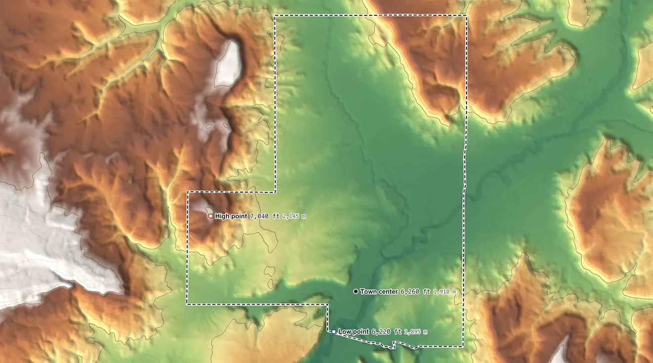Topographic elevation map of Manuelito, New Mexico, shaded from 6,220 ft on the southwest side to 7,040 ft on the northwest side