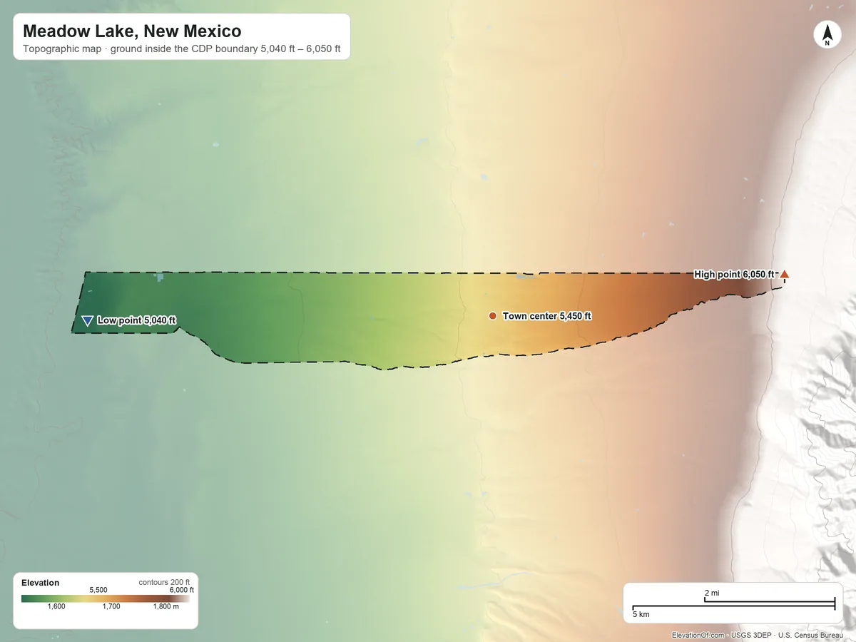 Topographic elevation map of Meadow Lake, New Mexico, shaded from 5,040 ft on the west side to 6,050 ft at the foot of the Manzanita Mountains