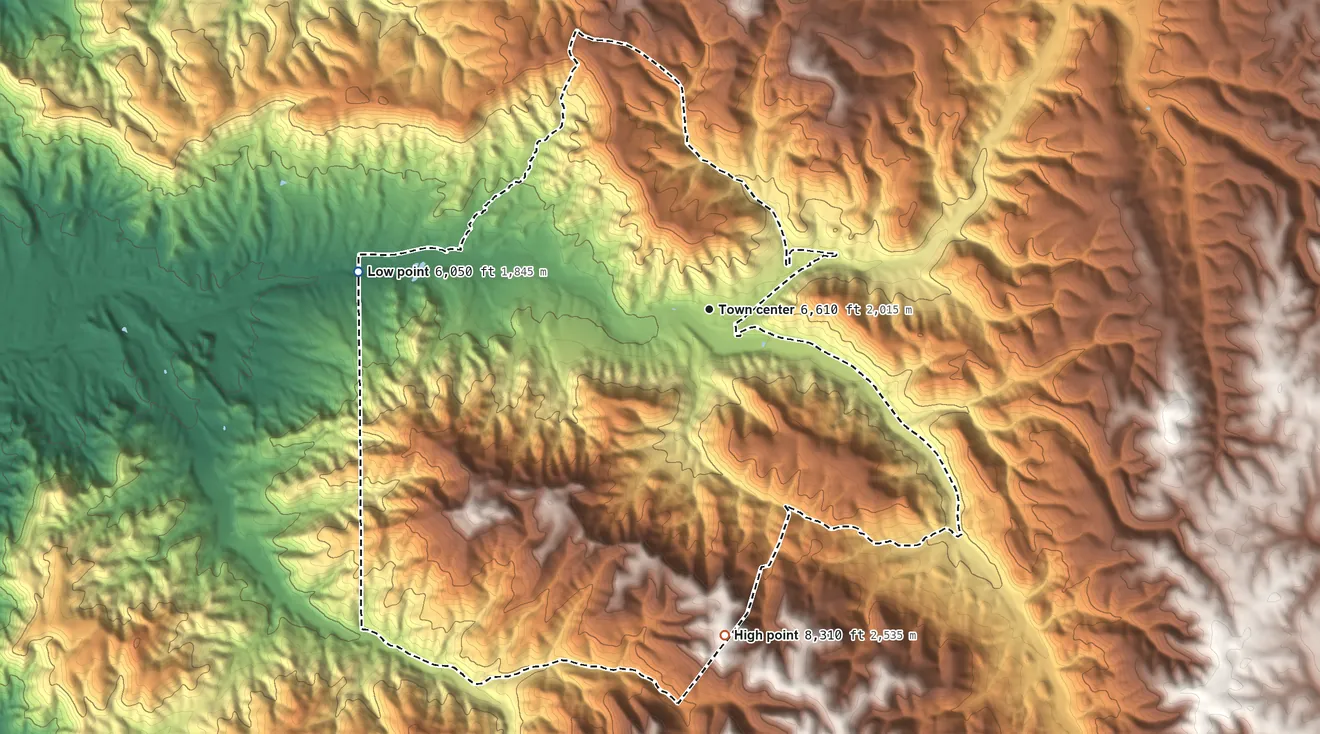 Topographic elevation map of Mescalero, New Mexico, shaded from 6,050 ft on the west side to 8,310 ft on the south side