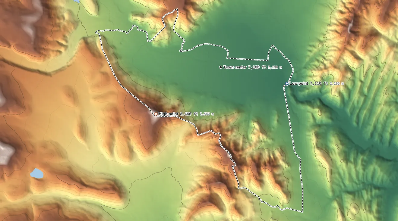 Topographic elevation map of Mora, New Mexico, shaded from 7,110 ft on the east side to 8,460 ft on the southwest side