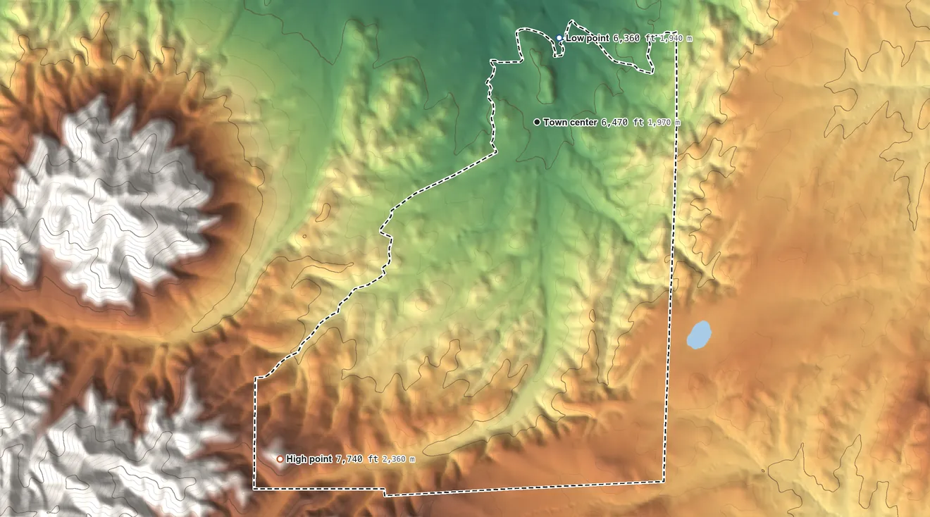Topographic elevation map of Nogal, New Mexico, shaded from 6,360 ft on the north side to 7,740 ft at the foot of the Vera Cruz Mountains
