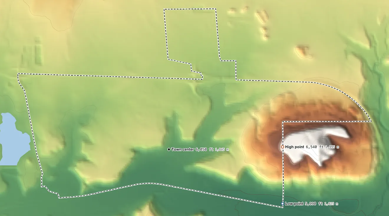 Topographic elevation map of North Acomita Village, New Mexico, shaded from 5,990 ft on the southeast side to 6,540 ft on the east side