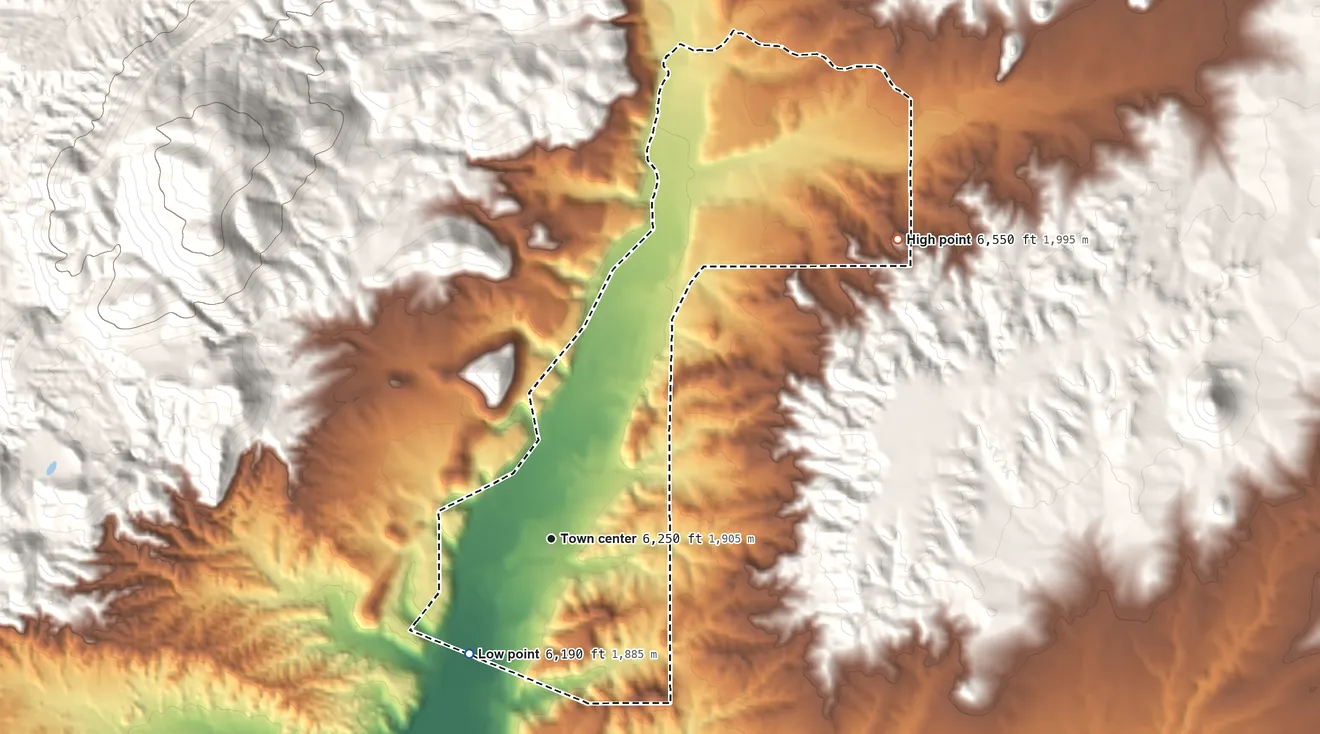 Topographic elevation map of Ojo Caliente, New Mexico, shaded from 6,190 ft on the southwest side to 6,550 ft at the foot of the La Madera Mountains