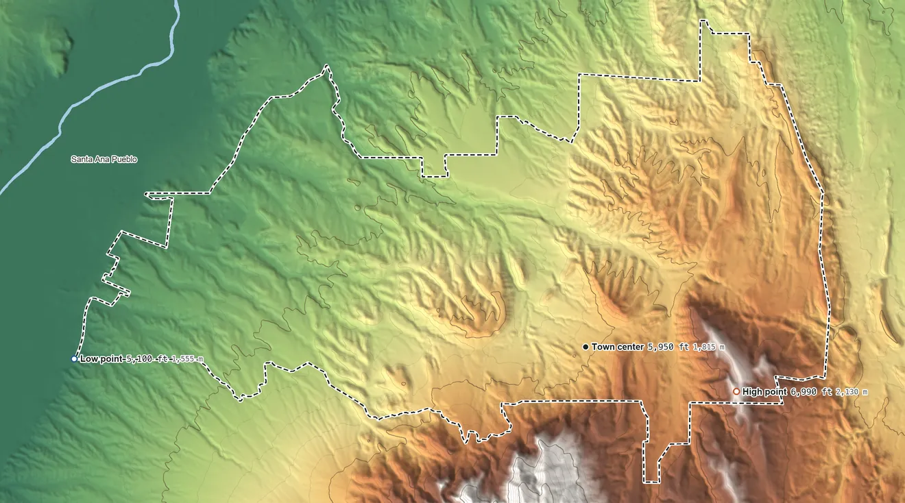 Topographic elevation map of Placitas, New Mexico, shaded from 5,100 ft on the west side to 6,990 ft on the east side