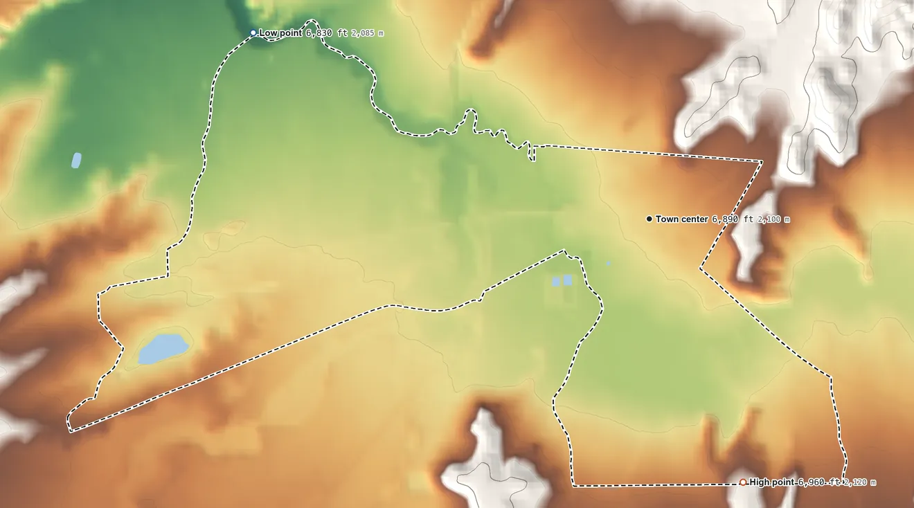 Topographic elevation map of Quemado, New Mexico, shaded from 6,830 ft on the northwest side to 6,960 ft on the south edge, below higher ground just outside