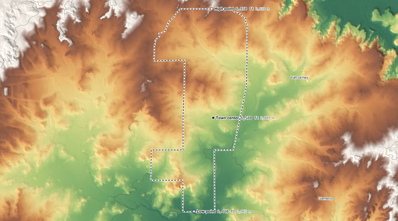 Topographic elevation map of Rock Springs, New Mexico, shaded from 6,440 ft on the south side to 6,950 ft on the north side