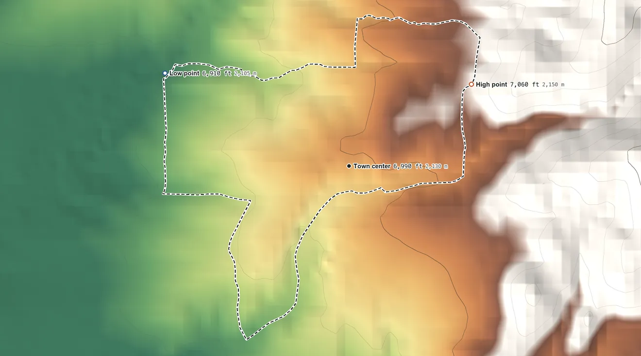 Topographic elevation map of Seton Village, New Mexico, shaded from 6,910 ft on the northwest side to 7,060 ft at the foot of the Cerrillos Hills