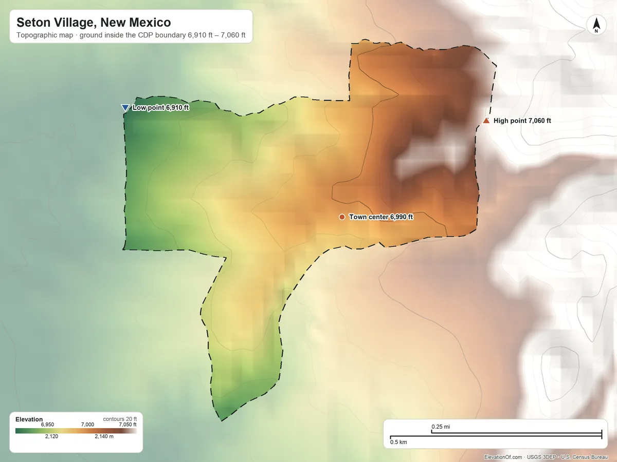 Topographic elevation map of Seton Village, New Mexico, shaded from 6,910 ft on the northwest side to 7,060 ft at the foot of the Cerrillos Hills