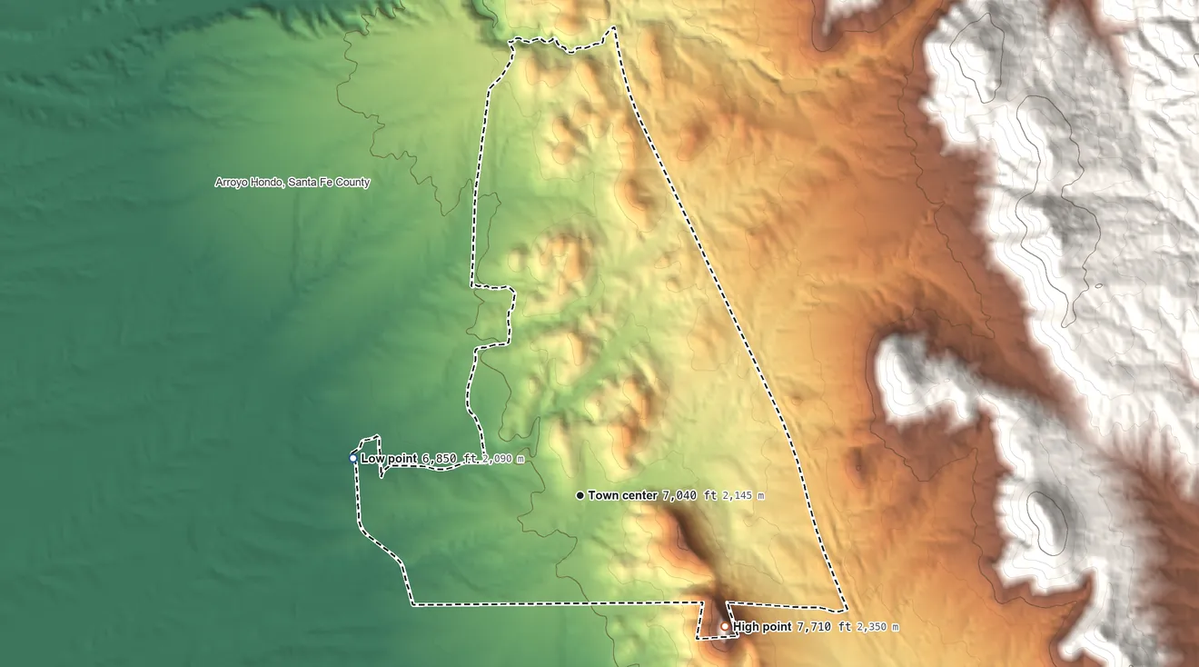 Topographic elevation map of Sunlit Hills, New Mexico, shaded from 6,850 ft on the west side to 7,710 ft at the foot of the Cerrillos Hills