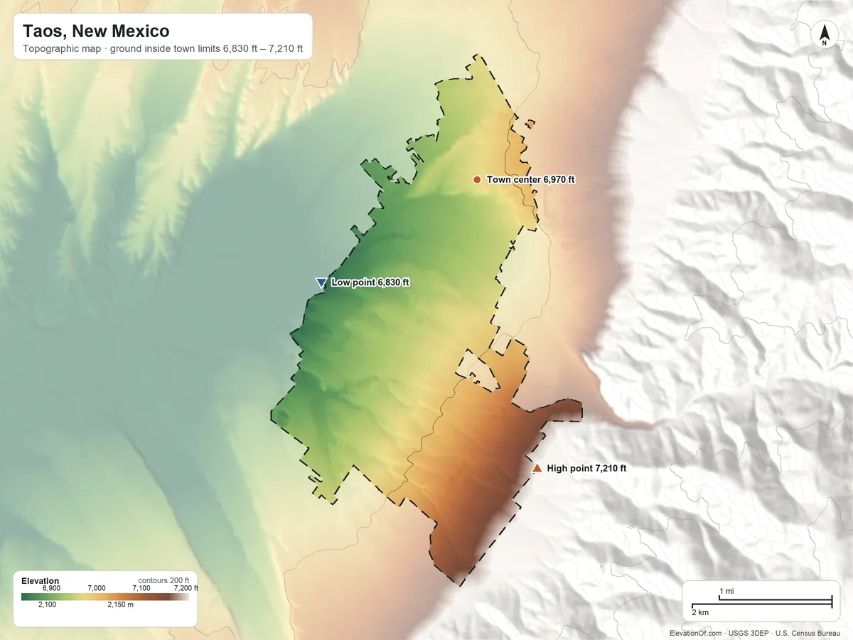 Topographic elevation map of Taos, New Mexico, shaded from 6,830 ft on the southwest side to 7,210 ft at the foot of the Rincon Mountains