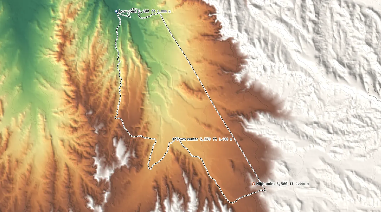 Topographic elevation map of Tesuque Pueblo, New Mexico, shaded from 6,200 ft on the northwest side to 6,560 ft on the southeast edge, below higher ground just outside
