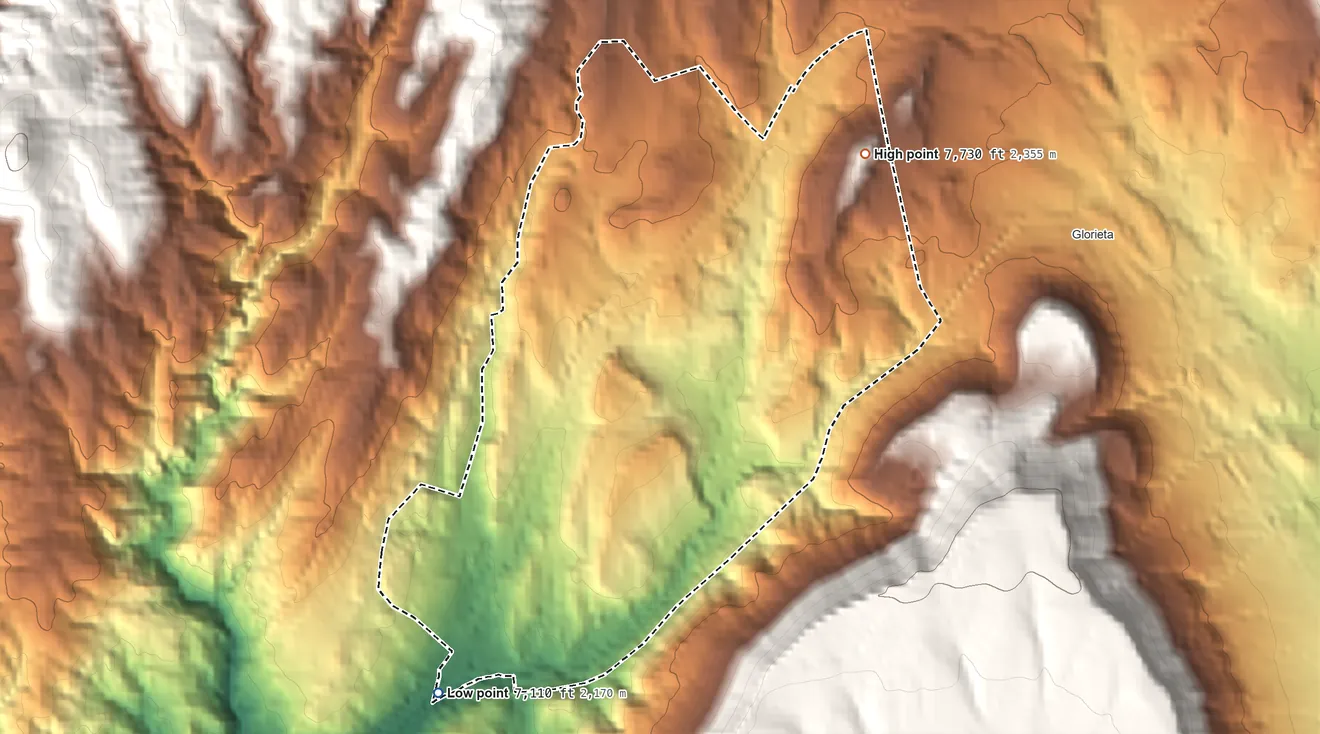 Topographic elevation map of Valencia, Santa Fe County, New Mexico, shaded from 7,110 ft on the southwest side to 7,730 ft on the northeast edge, below higher ground just outside