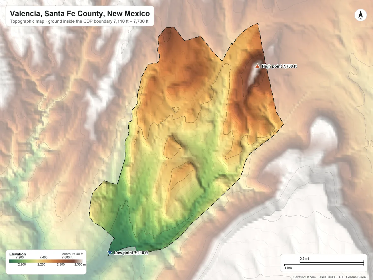 Topographic elevation map of Valencia, Santa Fe County, New Mexico, shaded from 7,110 ft on the southwest side to 7,730 ft on the northeast edge, below higher ground just outside