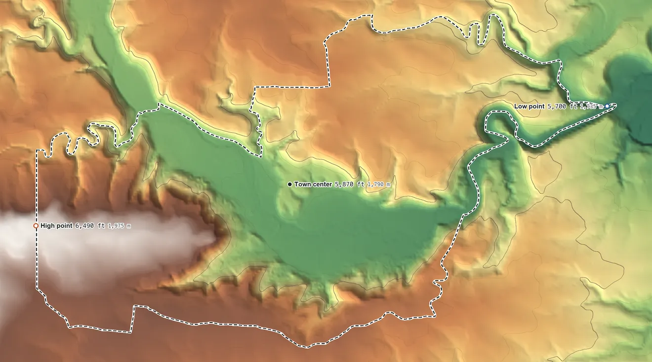 Topographic elevation map of Villanueva, New Mexico, shaded from 5,700 ft on the east side to 6,490 ft on the west side