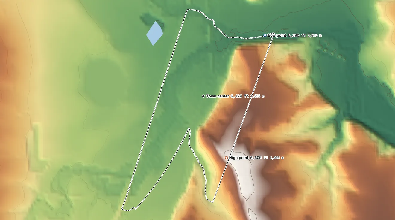 Topographic elevation map of Watrous, New Mexico, shaded from 6,390 ft on the northeast side to 6,600 ft on the south side