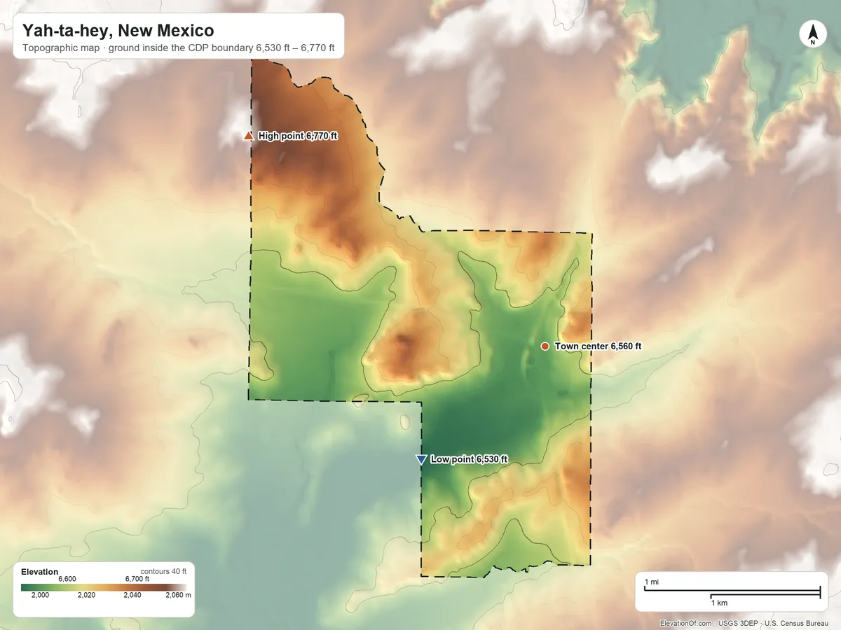Topographic elevation map of Yah-ta-hey, New Mexico, shaded from 6,530 ft on the southwest side to 6,770 ft on the northwest side