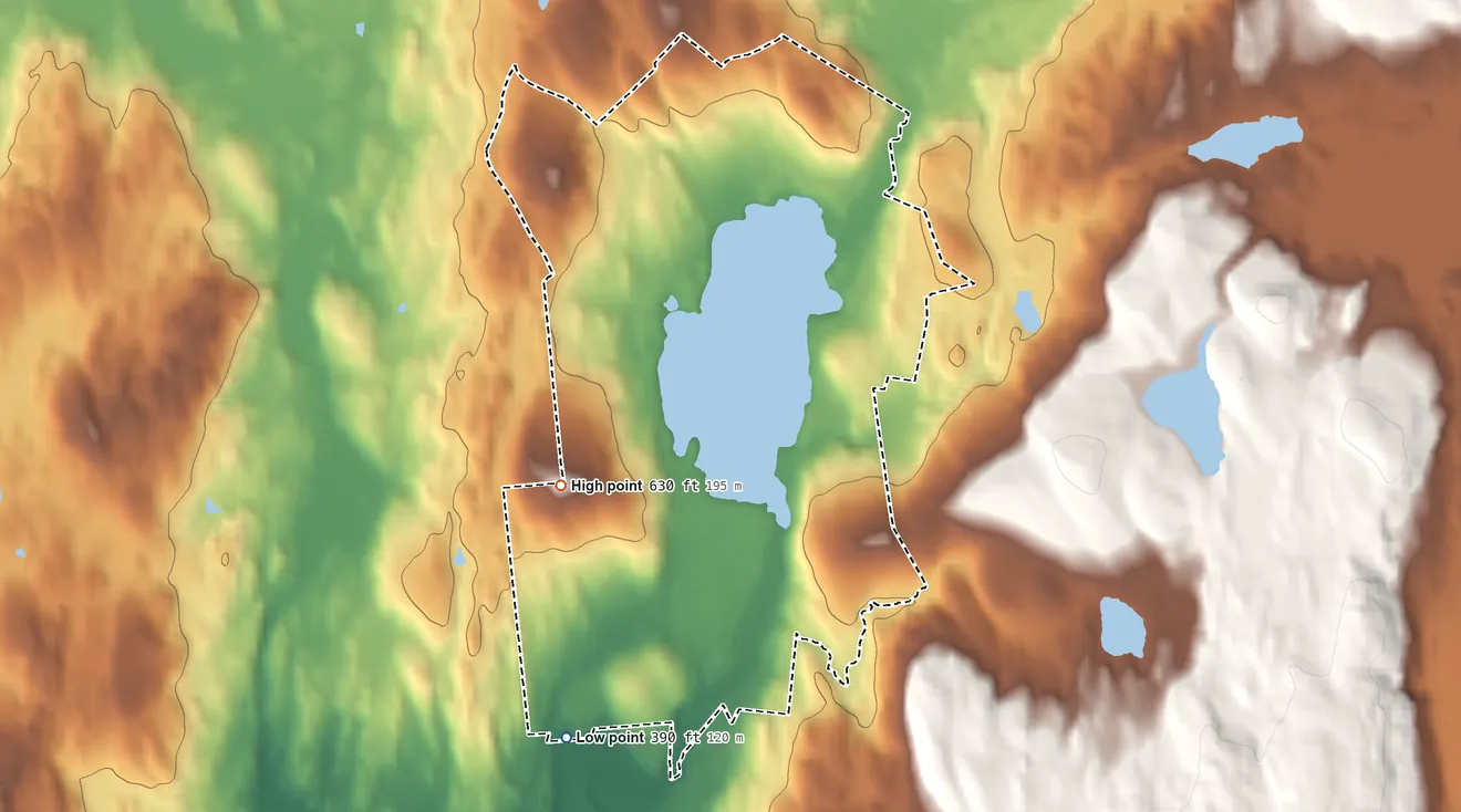 Topographic elevation map of Nassau Lake, New York, shaded from 390 ft on the south side to 630 ft on the southwest side