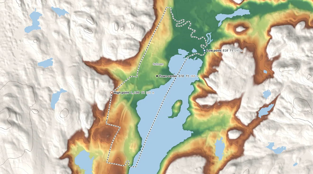 Topographic elevation map of Schroon Lake, New York, shaded from 810 ft on the northeast side to 1,100 ft on the west edge, below higher ground just outside