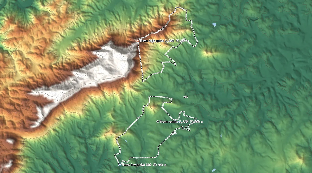 Topographic elevation map of Columbus, North Carolina, shaded from 980 ft on the southwest side to 2,390 ft on the north edge, below higher ground just outside