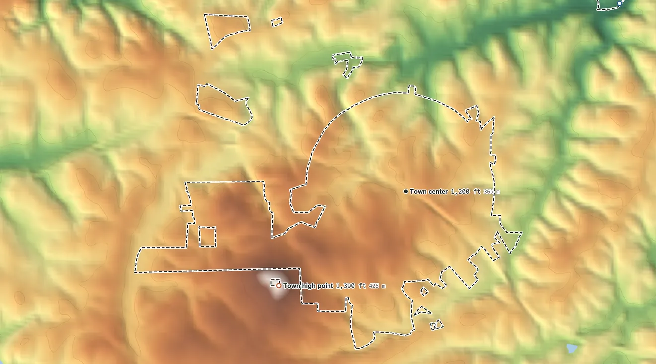 Topographic elevation map of Drexel, North Carolina, shaded from 1,010 ft on the northeast side to 1,390 ft at the foot of the Montague Hills