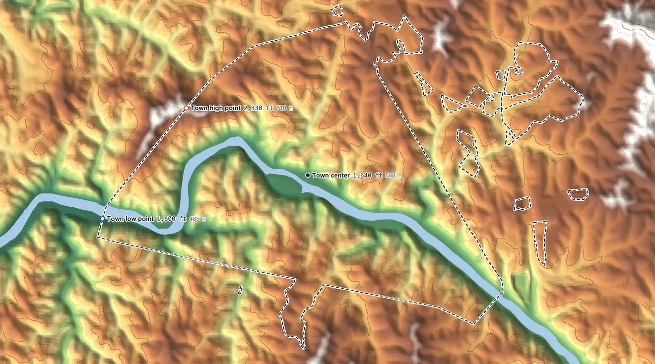 Topographic elevation map of Marshall, North Carolina, shaded from 1,600 ft on the west side to 2,330 ft at the foot of the Bald Mountains