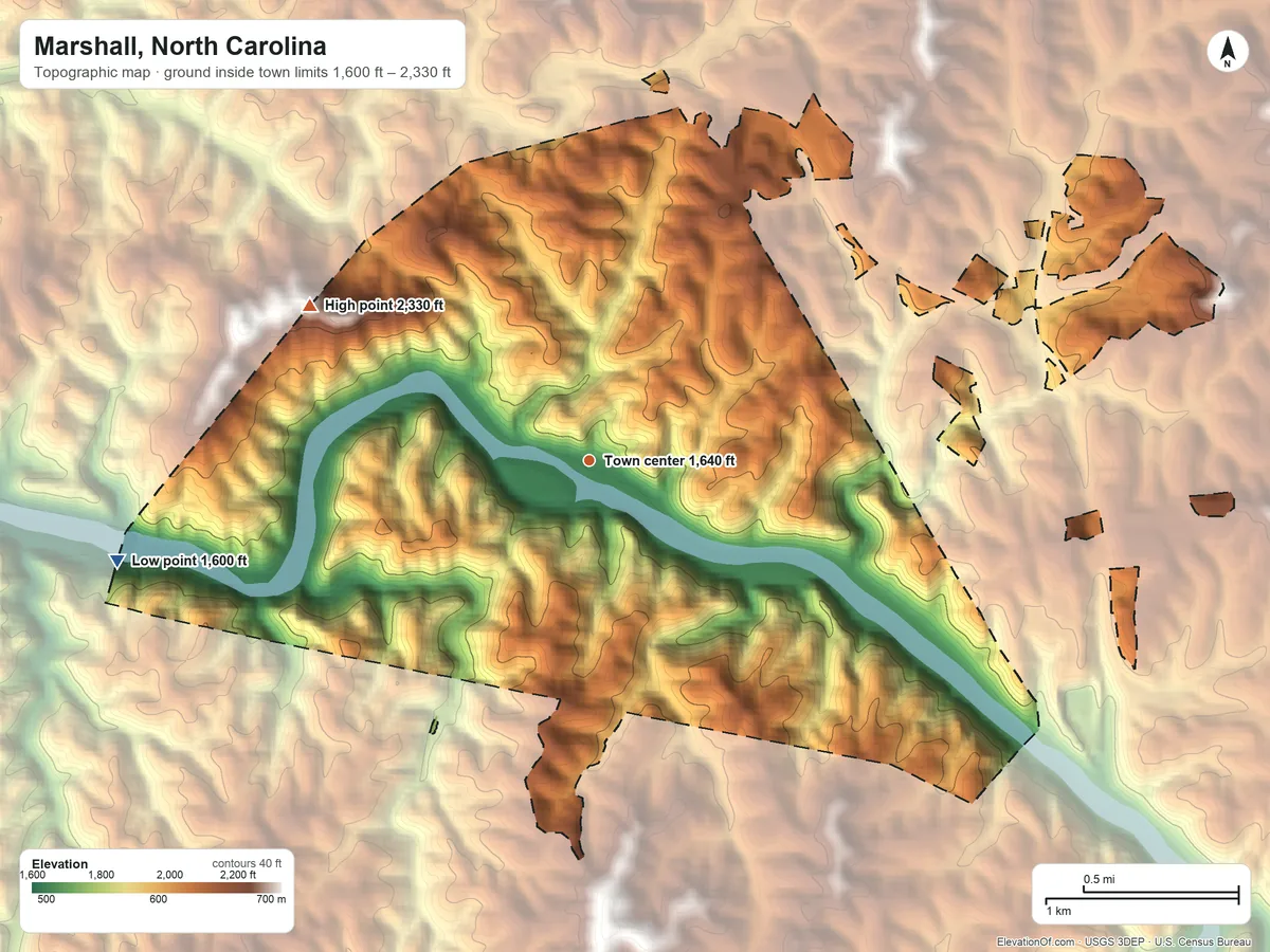 Topographic elevation map of Marshall, North Carolina, shaded from 1,600 ft on the west side to 2,330 ft at the foot of the Bald Mountains
