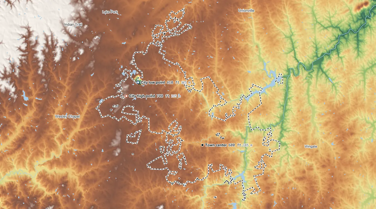 Topographic elevation map of Monroe, North Carolina, shaded from 410 ft on the northwest side to 700 ft on the northwest side