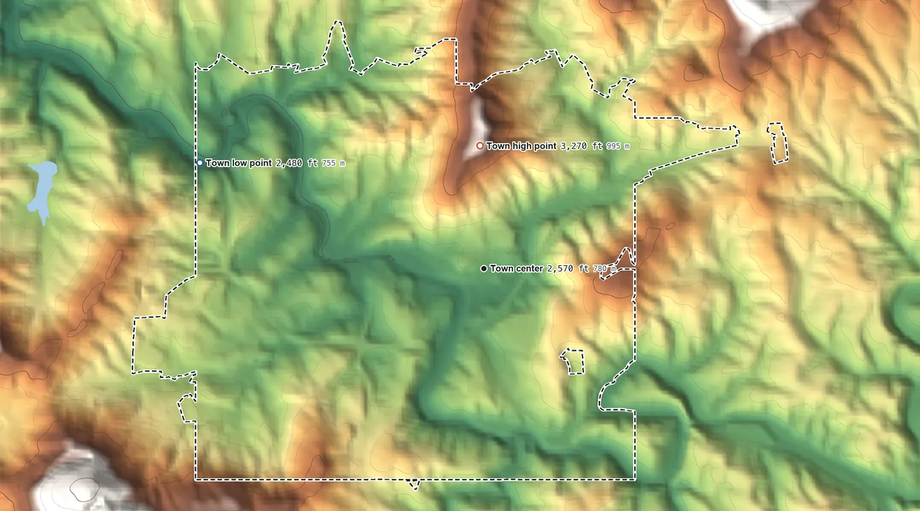 Topographic elevation map of Spruce Pine, North Carolina, shaded from 2,480 ft on the west side to 3,270 ft on Iowa Hill
