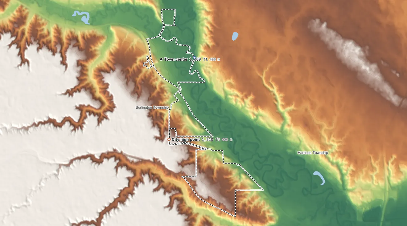 Topographic elevation map of Burlington, North Dakota, shaded from 1,560 ft on the east side to 1,810 ft on the south side