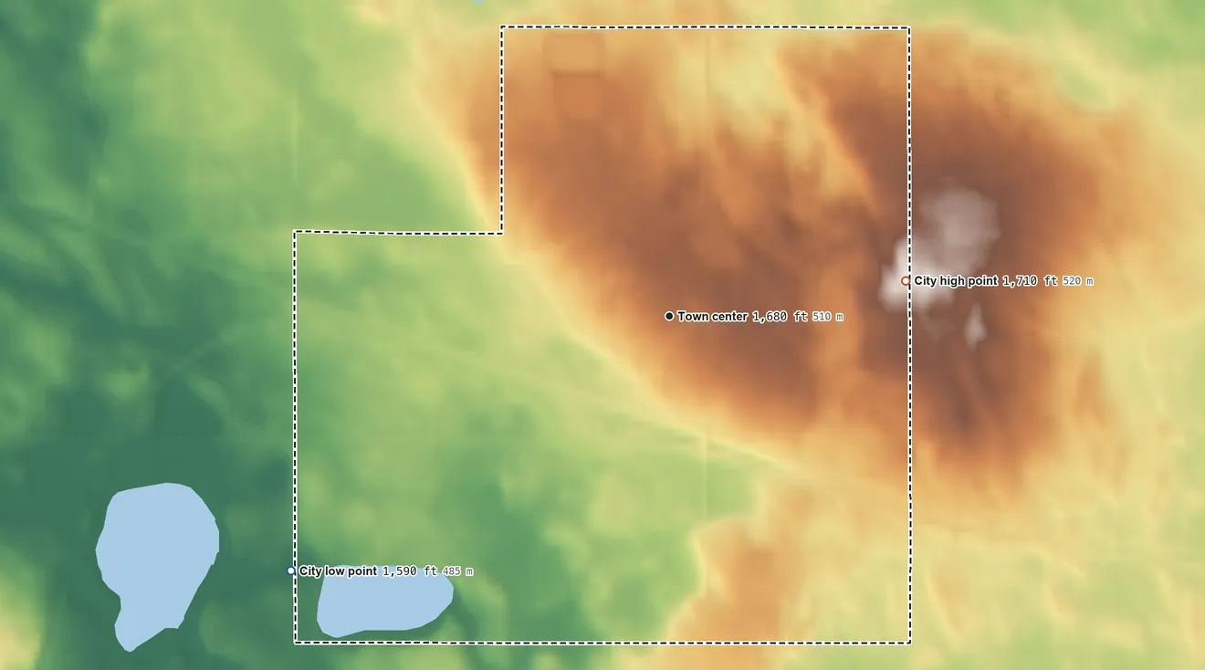 Topographic elevation map of Drake, North Dakota, shaded from 1,590 ft on the southwest side to 1,710 ft on the east side