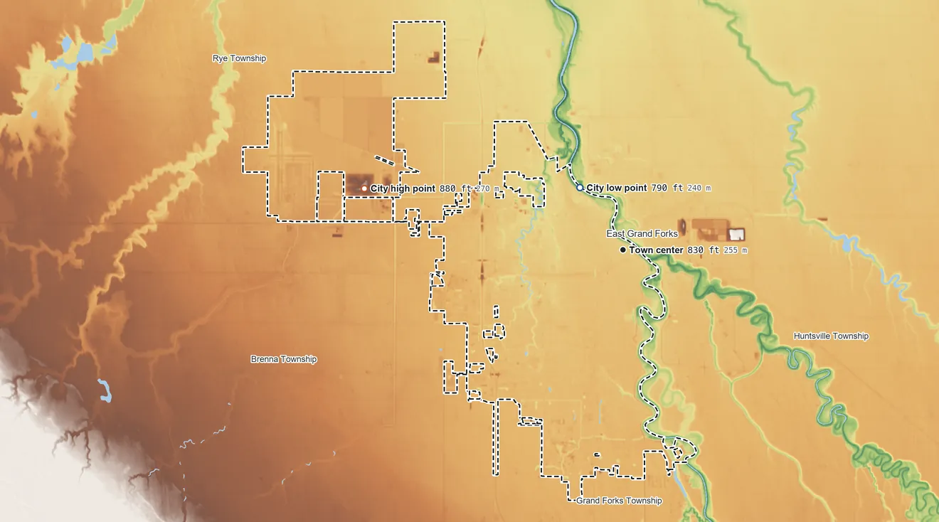 Topographic elevation map of Grand Forks, North Dakota, shaded from 790 ft on the northwest side to 880 ft on the west side