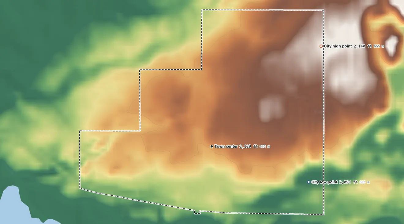 Topographic elevation map of Grenora, North Dakota, shaded from 2,090 ft on the east side to 2,140 ft on the northeast side