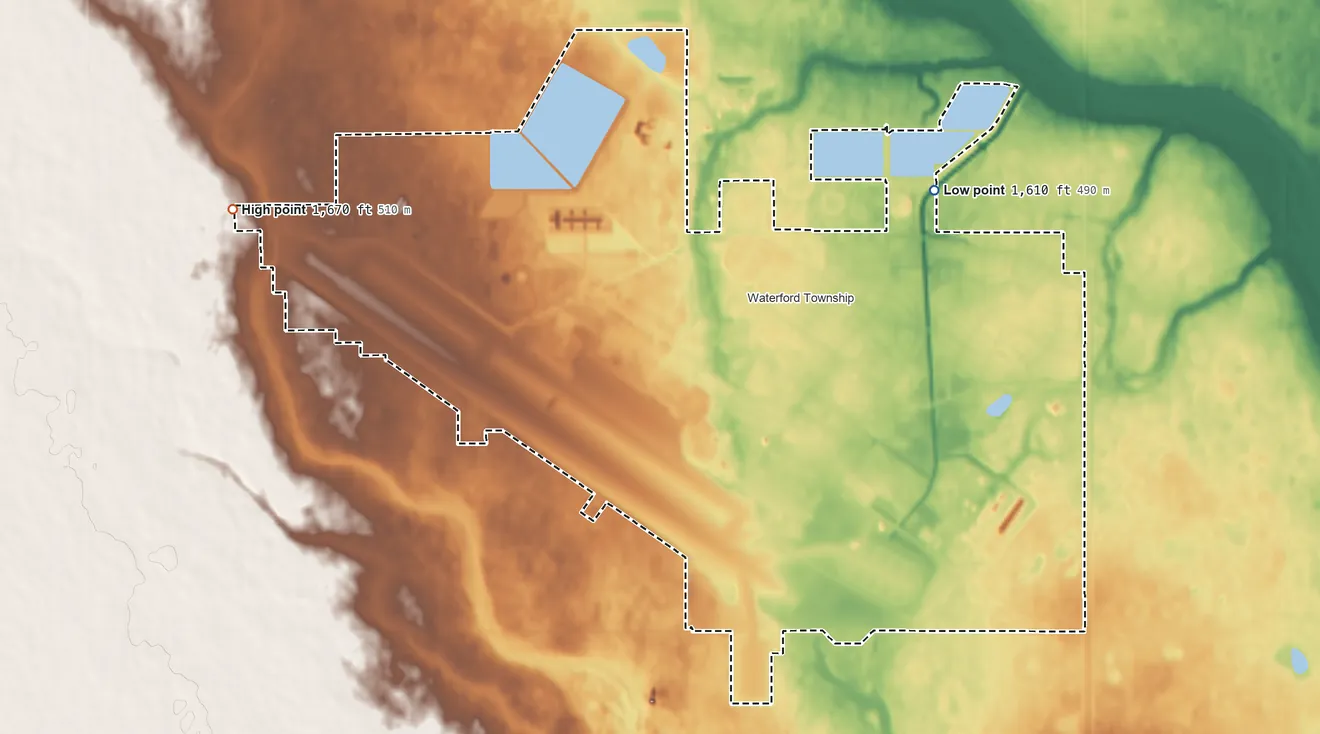 Topographic elevation map of Minot AFB, North Dakota, shaded from 1,610 ft on the north side to 1,670 ft on the west side