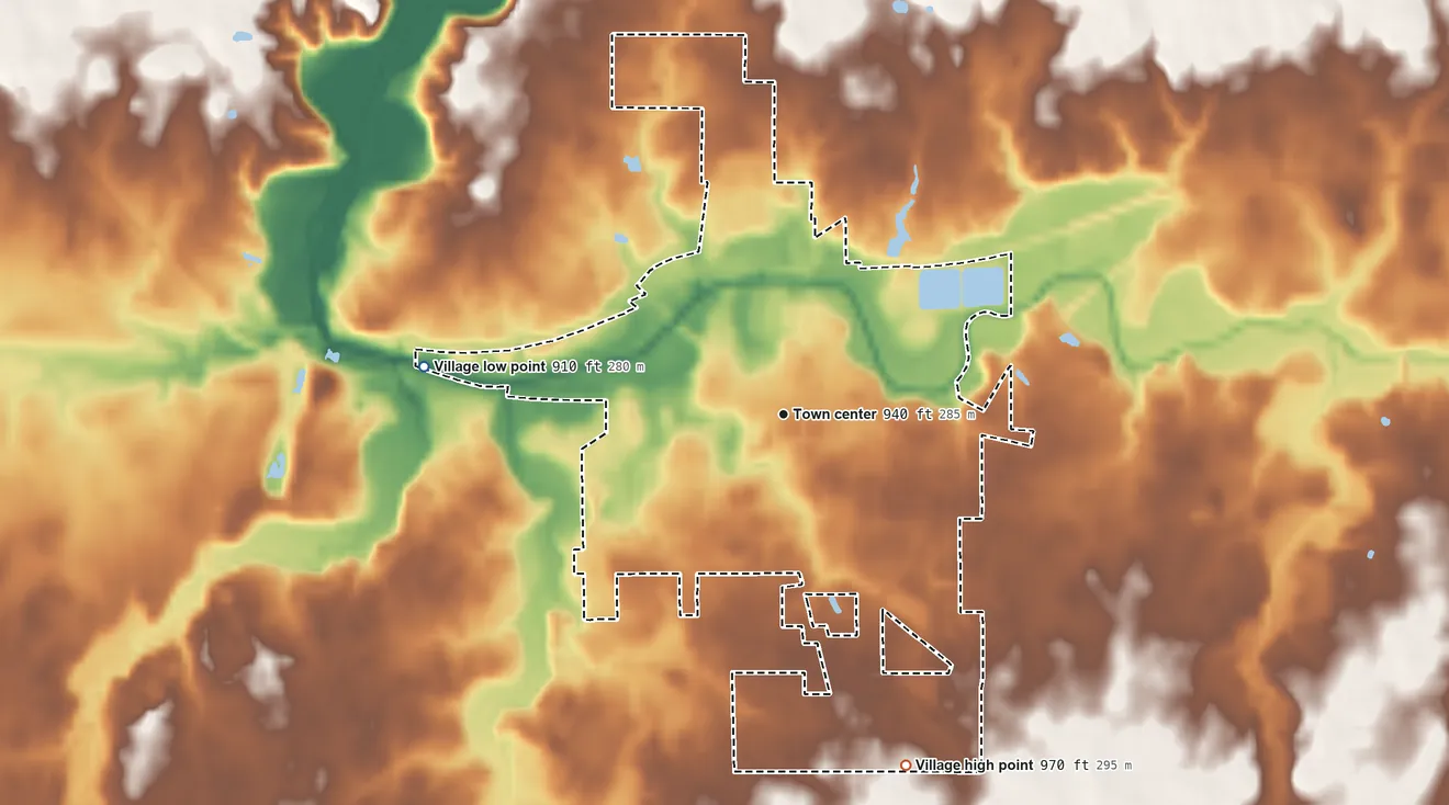 Topographic elevation map of Fort Recovery, Ohio, shaded from 910 ft on the west side to 970 ft on the south side