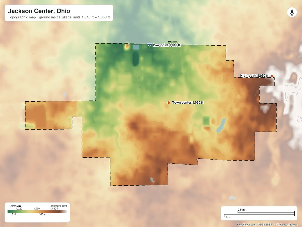 Topographic elevation map of Jackson Center, Ohio, shaded from 1,010 ft on the north side to 1,050 ft on the east side