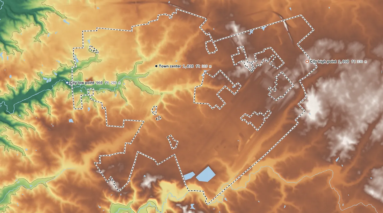 Topographic elevation map of Wilmington, Ohio, shaded from 960 ft on the west side to 1,090 ft on the east side