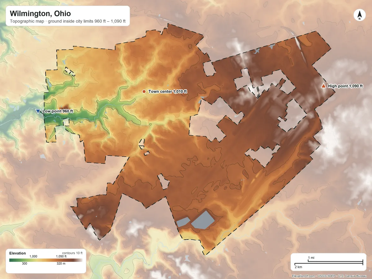 Topographic elevation map of Wilmington, Ohio, shaded from 960 ft on the west side to 1,090 ft on the east side