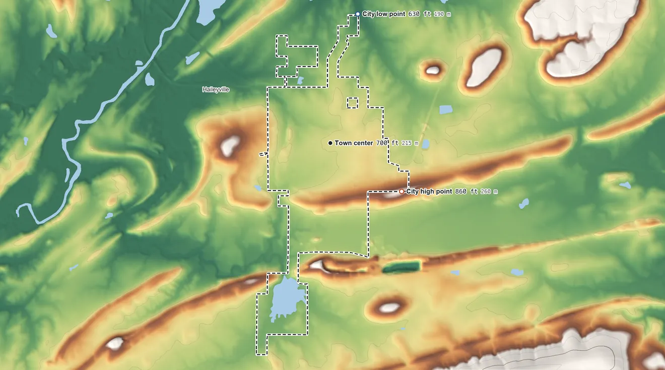 Topographic elevation map of Hartshorne, Oklahoma, shaded from 630 ft on the north side to 860 ft on the southeast side