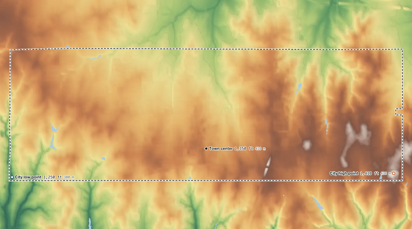 Topographic elevation map of Mustang, Oklahoma, shaded from 1,250 ft on the west side to 1,410 ft on the east side