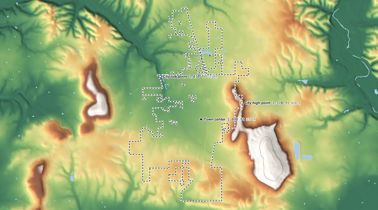 Topographic elevation map of Stilwell, Oklahoma, shaded from 1,030 ft on the northwest side to 1,370 ft on the east side