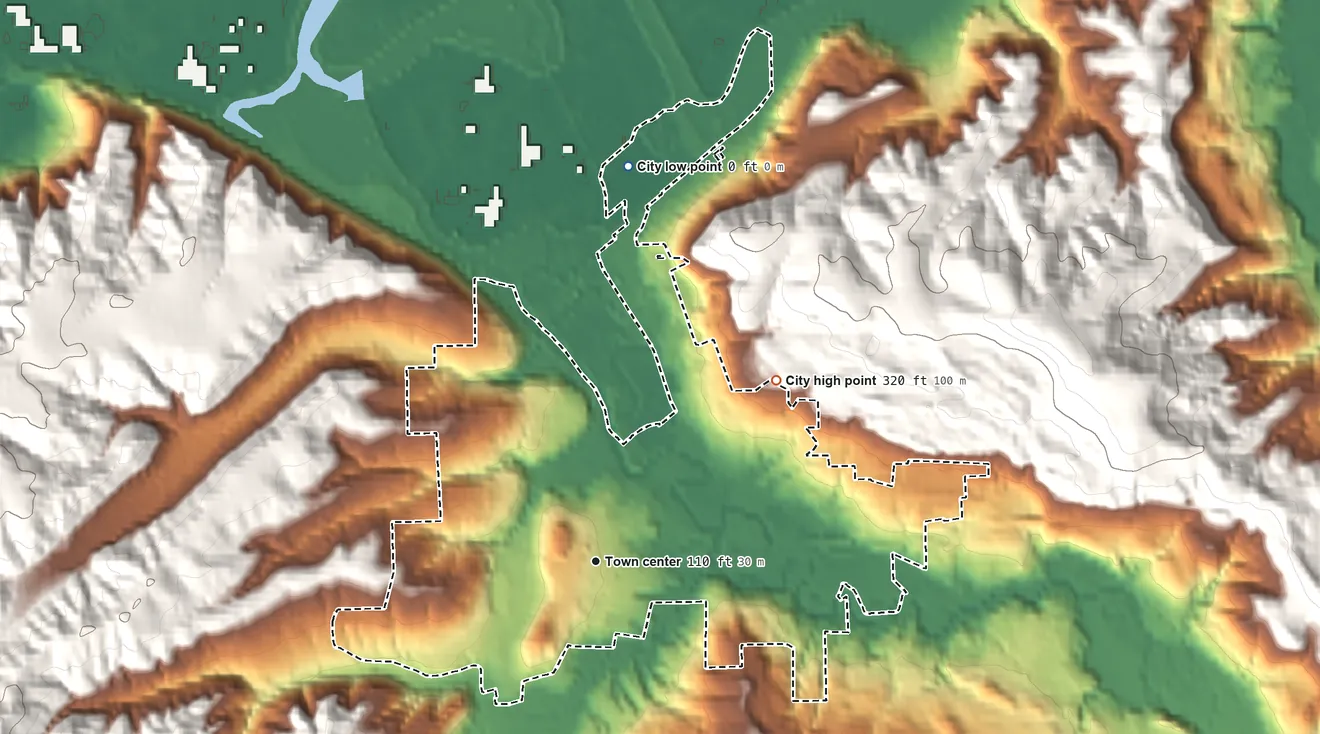 Topographic elevation map of Clatskanie, Oregon, shaded from 0 ft on the north side to 320 ft on the northeast edge, below higher ground just outside