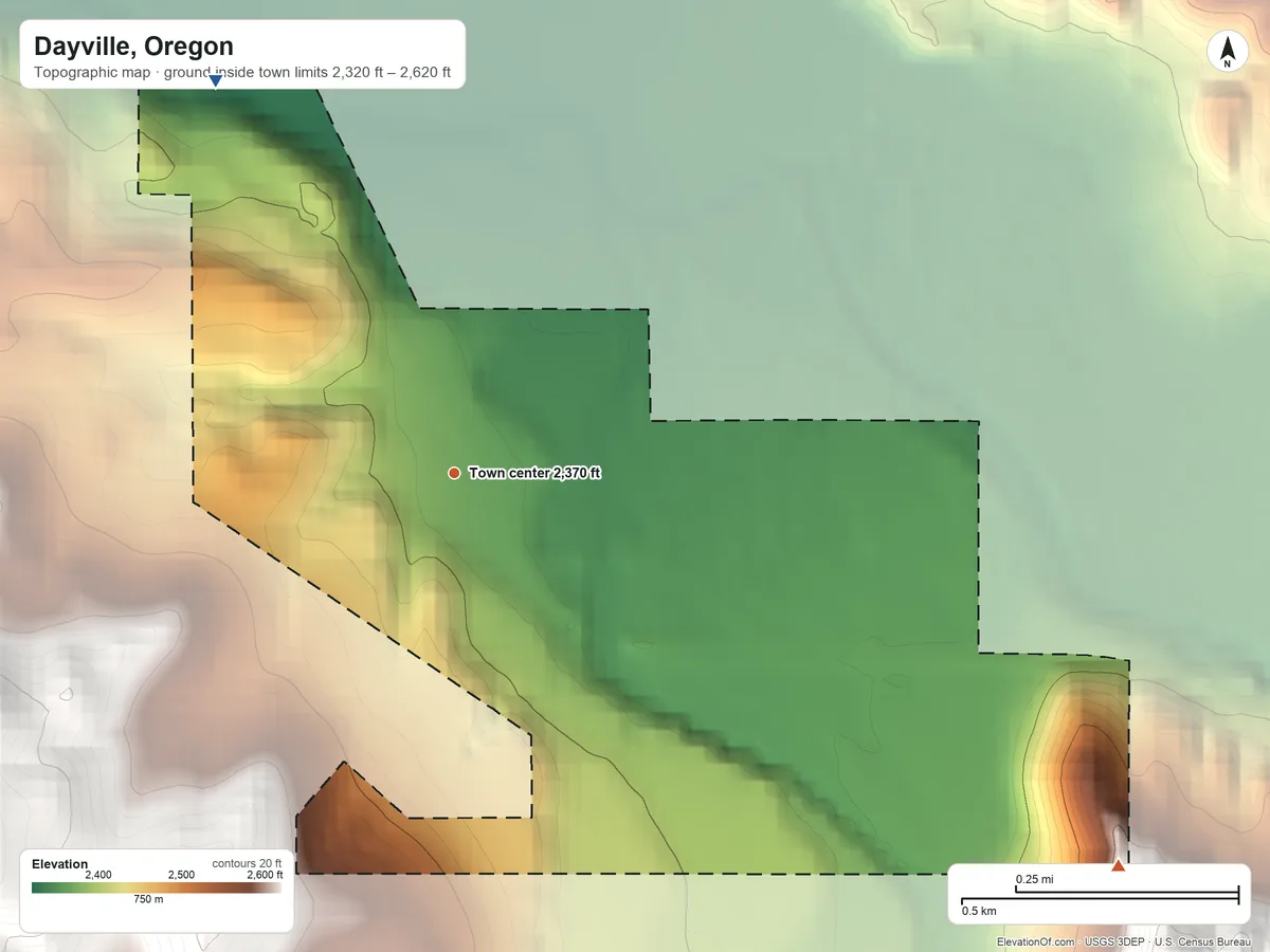 Topographic elevation map of Dayville, Oregon, shaded from 2,320 ft on the northwest side to 2,620 ft on the southeast edge, below higher ground just outside