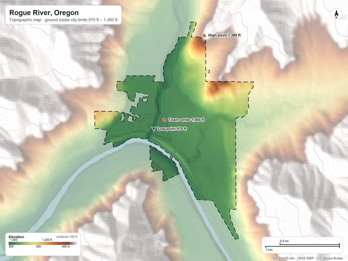 Topographic elevation map of Rogue River, Oregon, shaded from 970 ft near the middle to 1,380 ft on the northeast edge, below higher ground just outside