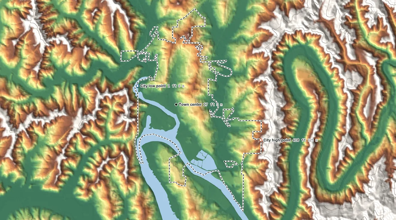 Topographic elevation map of Toledo, Oregon, shaded from 1 ft on the northwest side to 410 ft on the southeast edge, below higher ground just outside