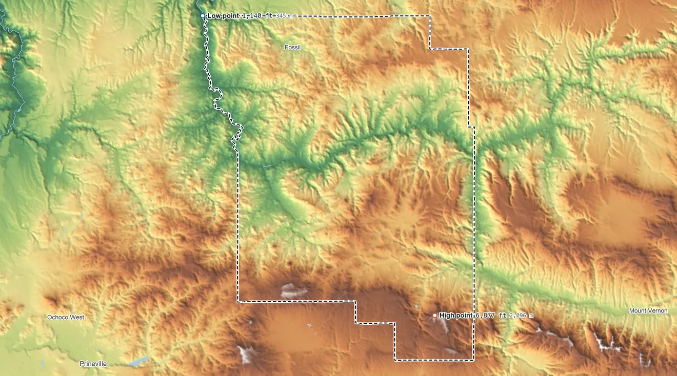Topographic elevation map of Wheeler County, Oregon, shaded from 1,140 ft on the northwest side to 6,877 ft on Spanish Peak