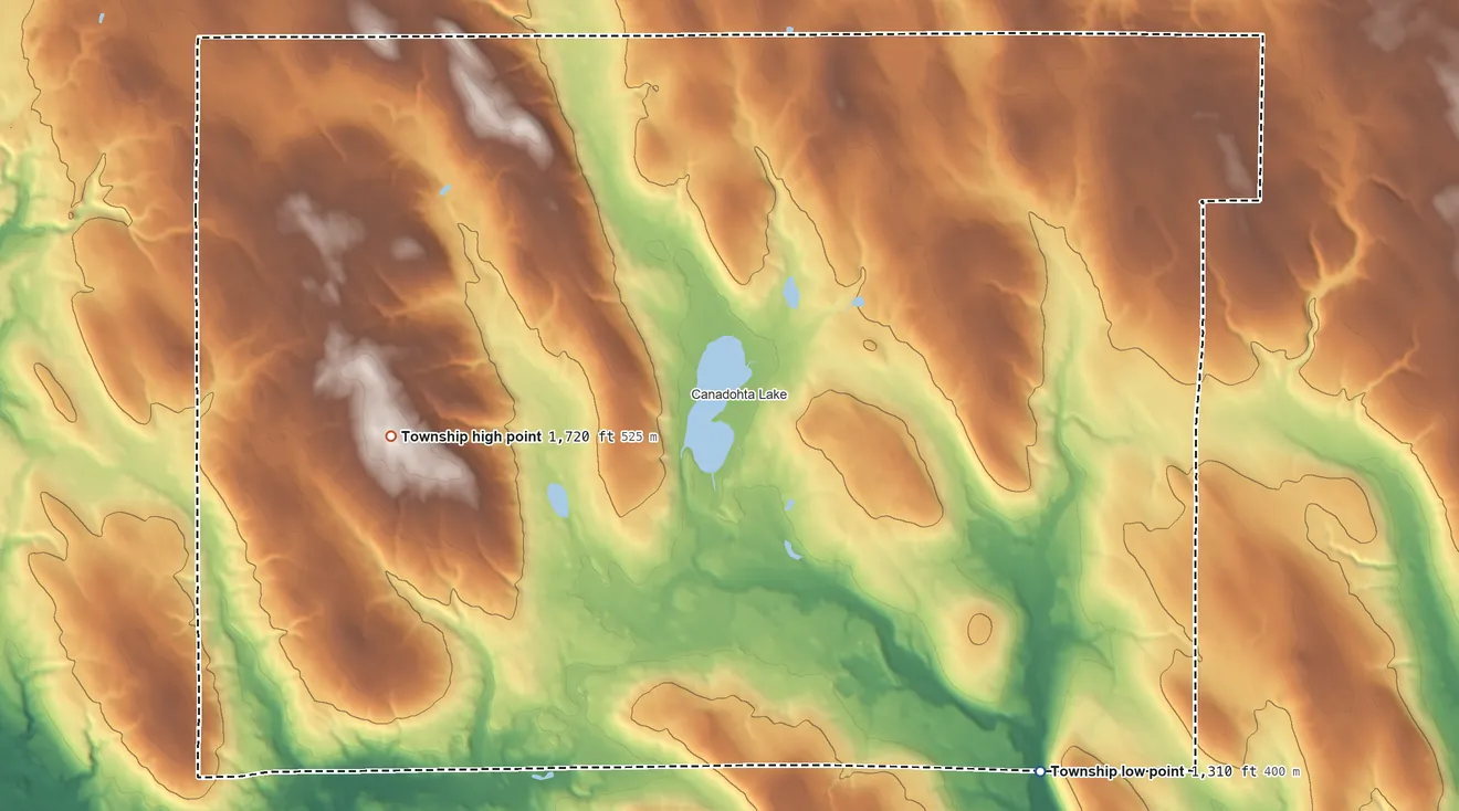 Topographic elevation map of Bloomfield Township, Pennsylvania, shaded from 1,310 ft on the southeast side to 1,720 ft on the west side
