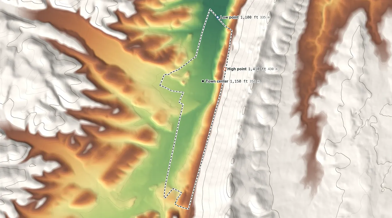 Topographic elevation map of Claysburg, Pennsylvania, shaded from 1,100 ft on the north side to 1,410 ft at the foot of the Tussey Mountain