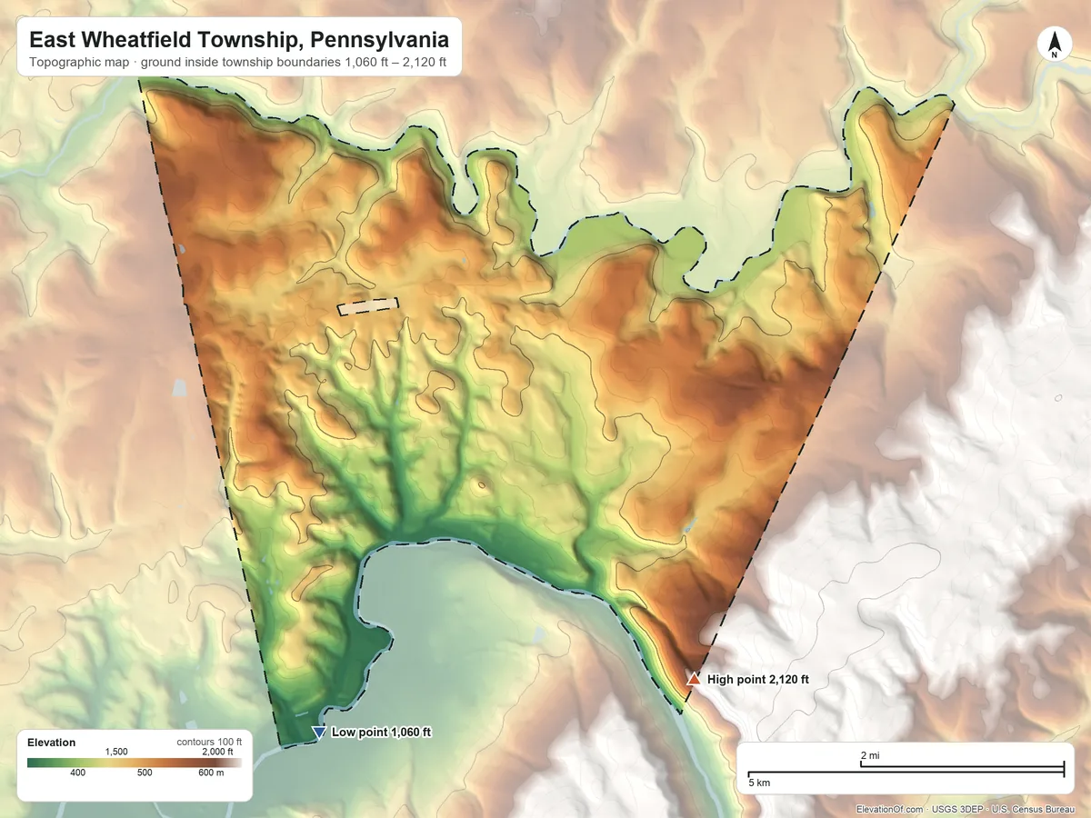 Topographic elevation map of East Wheatfield Township, Pennsylvania, shaded from 1,060 ft on the southwest side to 2,120 ft at the foot of the Laurel Hill