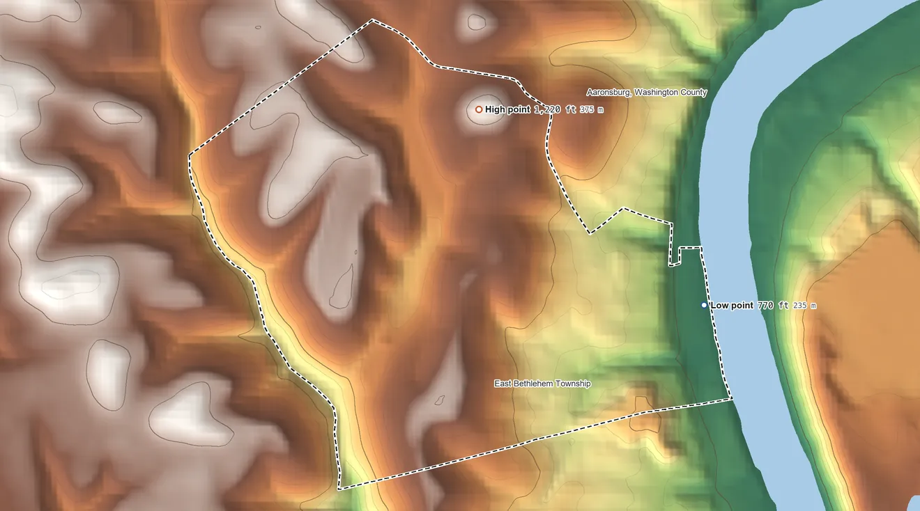 Topographic elevation map of Fredericktown, Pennsylvania, shaded from 770 ft on the east side to 1,220 ft on the north side